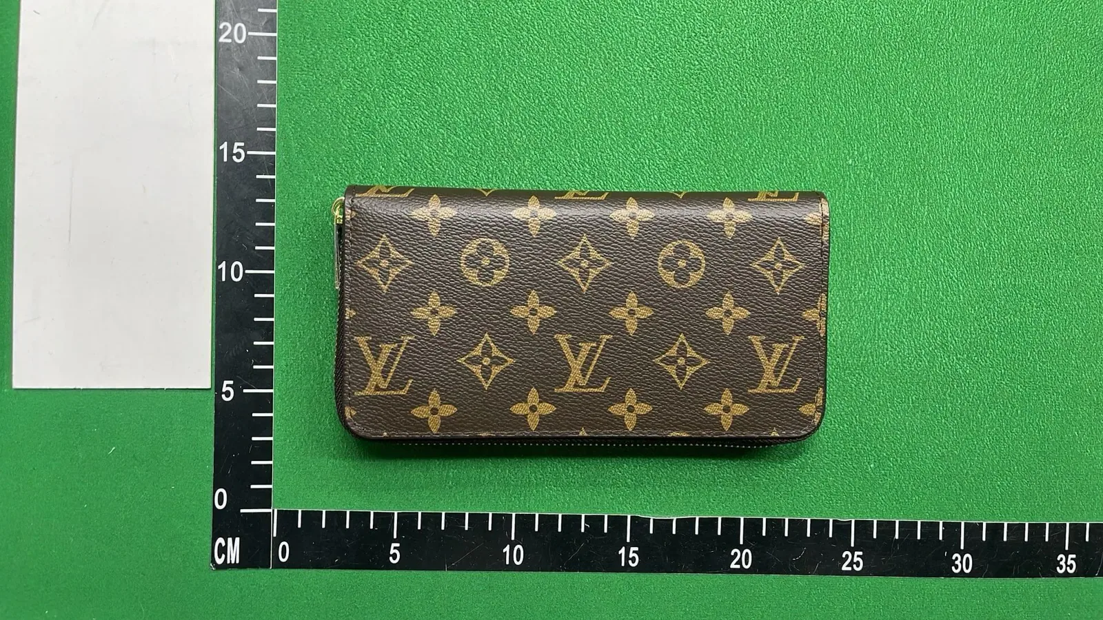 Kakobuy QC wallet horizontal view with ruler for scale