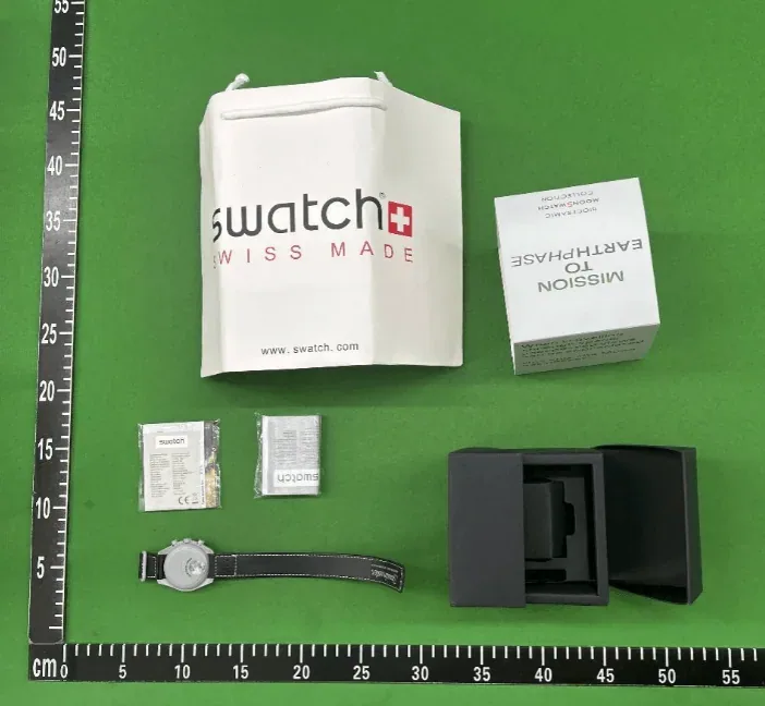 Kakobuy QC watch set with packaging and ruler for scale